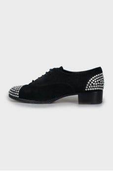 Suede shoes with rhinestones on the toes