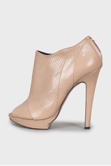 Beige ankle boots with perforation