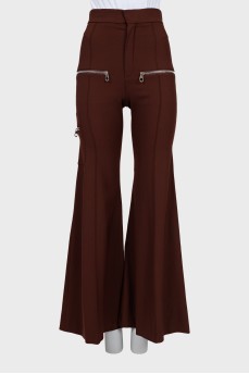 Flared trousers decorated with zippers