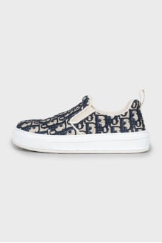 Textile slip-ons with signature print