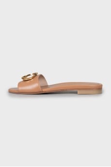 Brown leather flip flops with decor