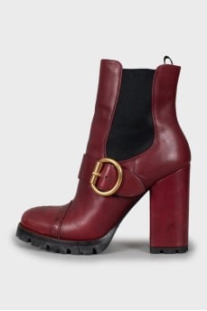 Red ankle boots with perforation
