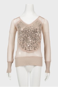 Blouse is decorated with sequins