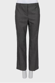 Trousers with arrows in a small print