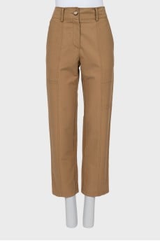 Beige trousers with raised seams