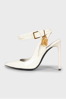 Patent leather shoes with a golden lock