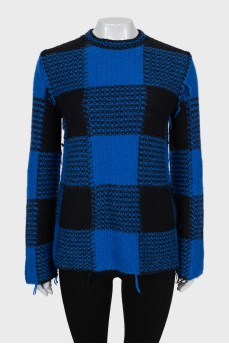 Checkered sweater with seams on the outside