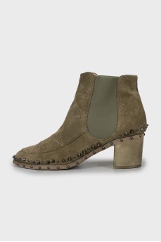 Green ankle boots decorated with spikes