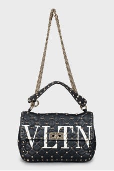 Quilted bag decorated with spikes