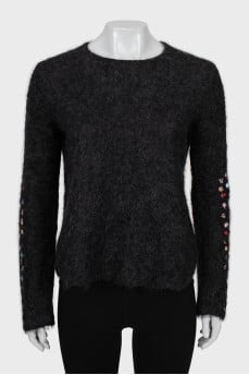 Loose sweater with embroidery on the sleeves