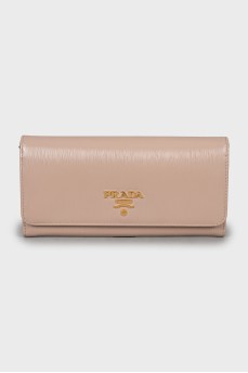 Beige wallet with golden logo