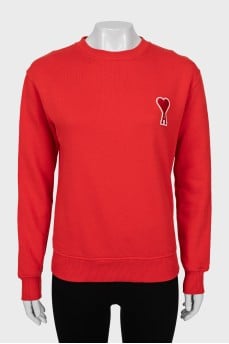 Red sweatshirt with brand logo