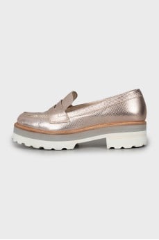 Gold loafers with embossed leather