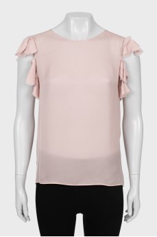 Beige tank top decorated with frills