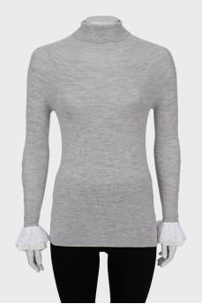 Wool turtleneck with ruffles on the sleeves