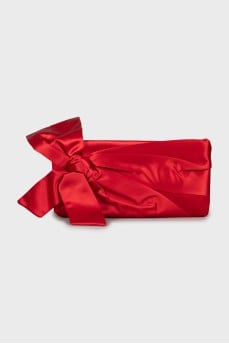 Textile clutch decorated with a bow