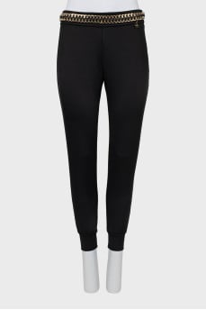 Slim fit trousers with waistband decoration