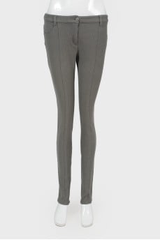 Gray trousers with stitched creases