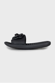 Black flip flops decorated with flowers