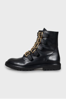 Leather boots with gold buckles