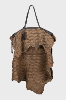Perforated leather bag with tag