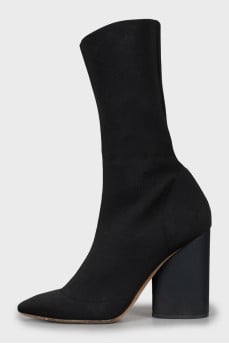 Ankle boots made of textile with a figured heel