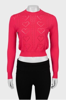 Pink jumper with perforated pattern