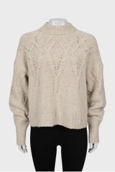 Beige sweater with textured pattern