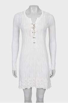 Knitted dress decorated with lacing