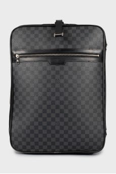 Suitcase made of canvas with a signature print