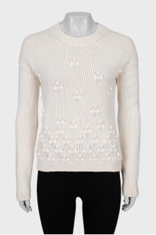 Knitted sweater with decorative embroidery