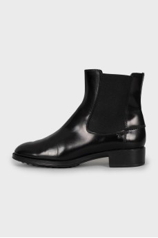 Black leather boots with textile inserts
