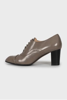 Leather shoes decorated with perforation
