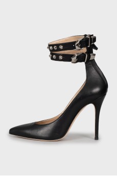 Leather shoes decorated with buckles and studs