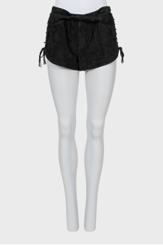 Leather shorts with lacing on the sides