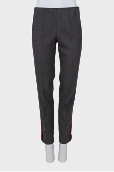 Trousers with red and black stripes on the sides