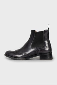 Leather boots decorated with perforation