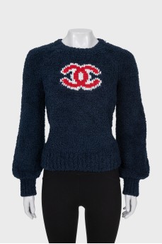 Dark blue sweater with brand logo