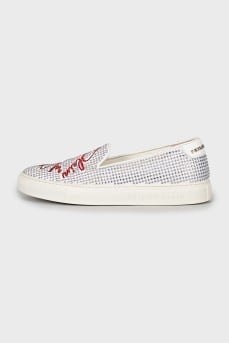 White slip-ons decorated with rhinestones