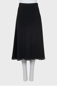 Skirt decorated with metal rings
