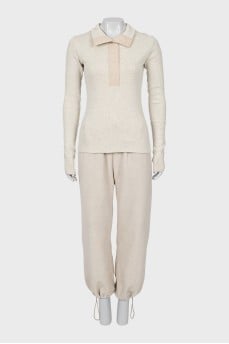 Suit of top and trousers with ties