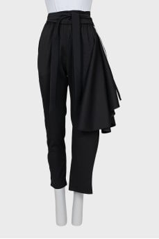 Asymmetrical cut trousers with stripes