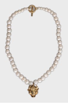 Pearl necklace with a bull pendant