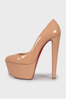 Beige high heel shoes