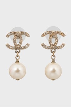 Earrings in the form of a brand emblem