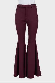 Red flared trousers with tag