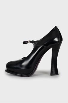 Black leather shoes with a figured heel