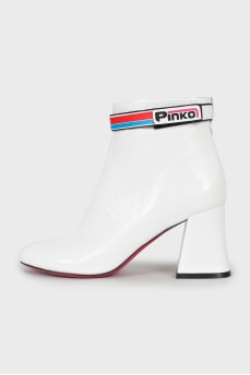 White ankle boots with trapezoid heels