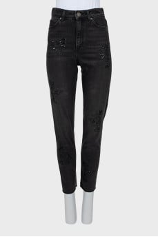Jeans decorated with sequins and beads