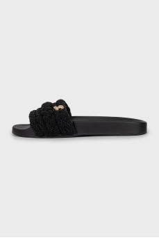 Black flip flops decorated with beads